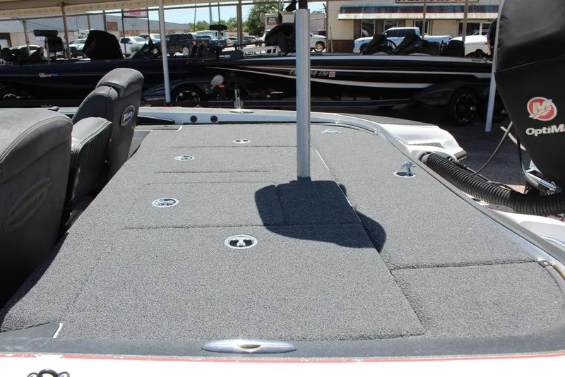 Slide: The Image of 2008 Triton Tr21 X boat deck with carpeted surface and seating area. - 10