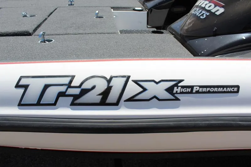 Slide: The Image of 2008 Triton Tr21 X High Performance boat logo on white surface. - 14