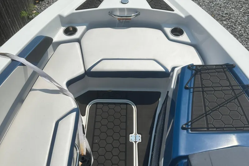 Slide: The Image of 2021 Scarab 165 ID boat interior with steering wheel and seating arrangement. - 10