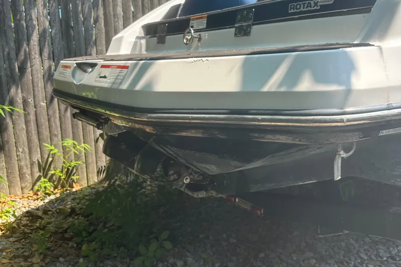 Slide: The Image of 2021 Scarab 165 ID boat interior with blue and white seating and hexagonal flooring. - 11