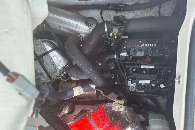 Slide: The Image of 2021 Scarab 165 ID boat interior with steering wheel and seating. - 13