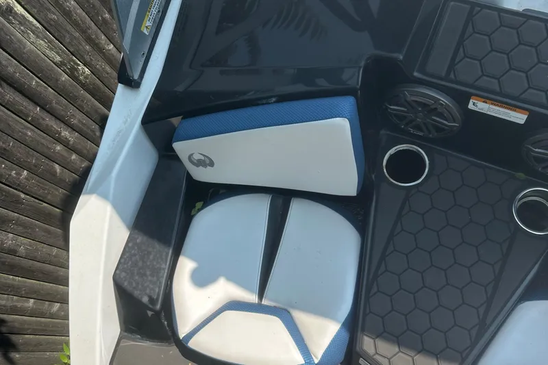 Slide: The Image of 2021 Scarab 165 ID jet boat, rear view, parked outdoors. - 4