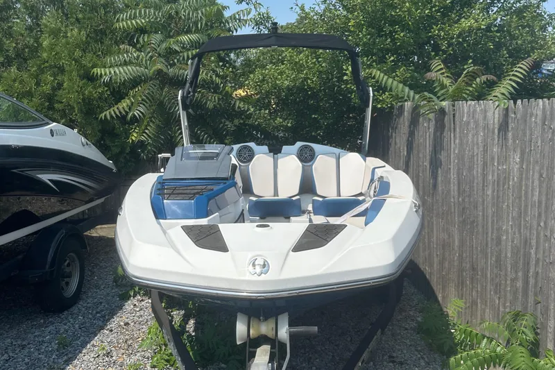 Slide: The Image of 2021 Scarab 165 ID boat interior with speaker, handle, and seating area. - 7