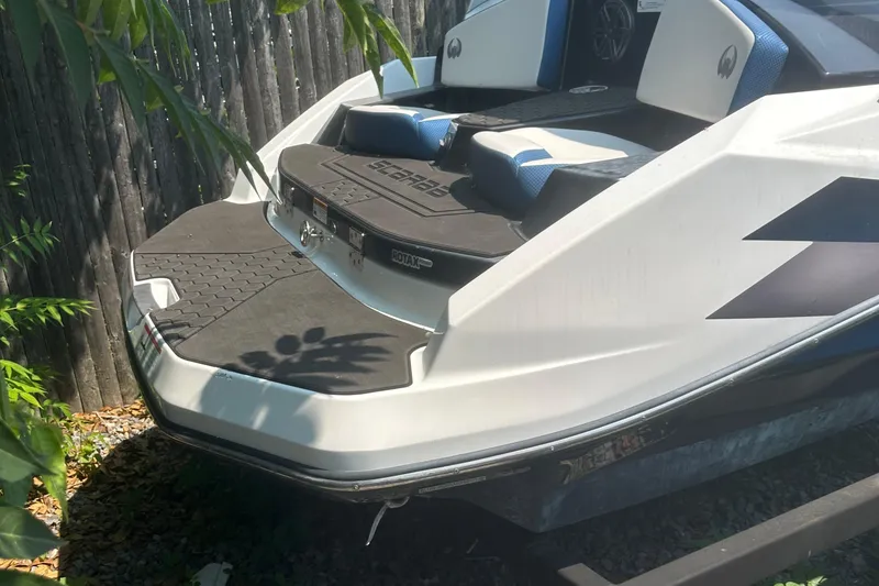 Slide: The Image of 2021 Scarab 165 ID boat interior with seating, cup holder, and storage net. - 8