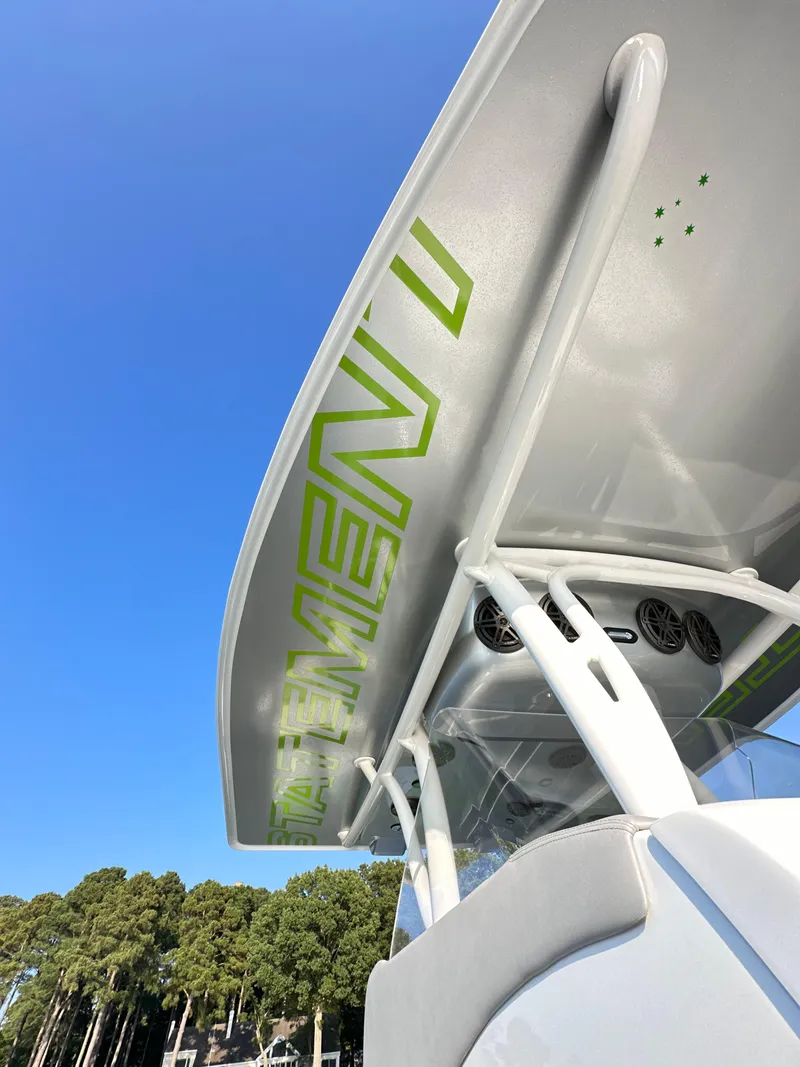 Slide: The Image of 2023 Statement 350 Open boat with sleek design and vibrant green accents. - 22