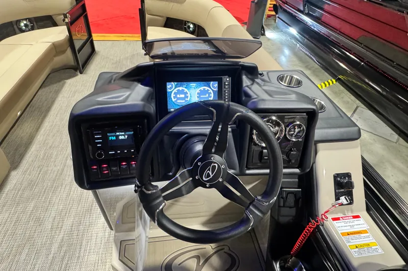 Slide: The Image of 2026 Veranda Relax VR265VLI boat dashboard with steering wheel and digital display. - 10