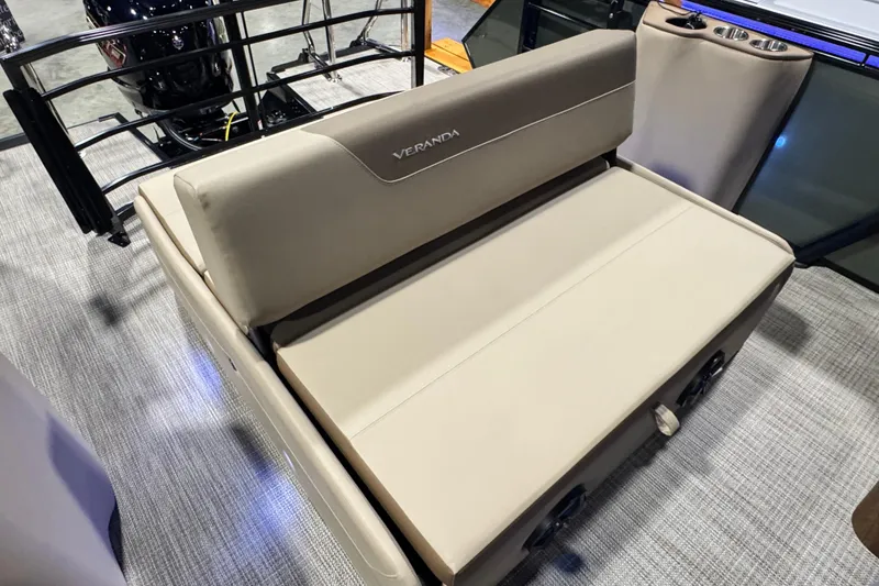 Slide: The Image of 2026 Veranda Relax VR265VLI boat seat with beige upholstery and cup holders. - 13