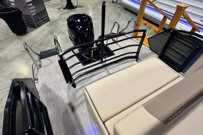 Slide: The Image of 2026 Veranda Relax VR265VLI pontoon boat interior with motor and seating. - 14