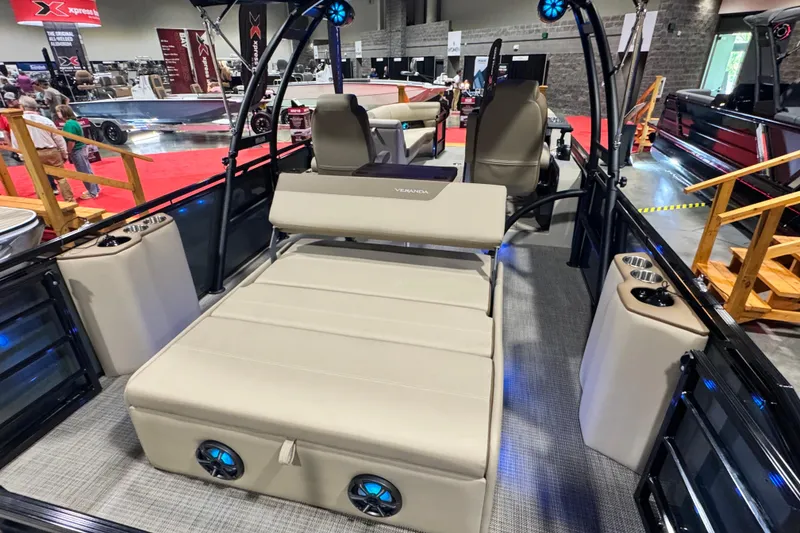 Slide: The Image of 2026 Veranda Relax VR265VLI pontoon boat interior with beige seating and modern amenities. - 16