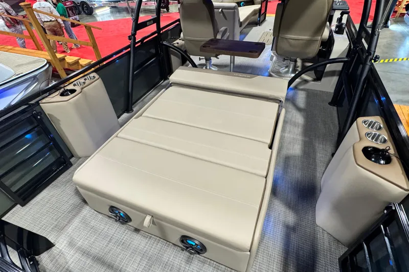 Slide: The Image of 2026 Veranda Relax VR265VLI boat interior with beige seating and cup holders. - 17