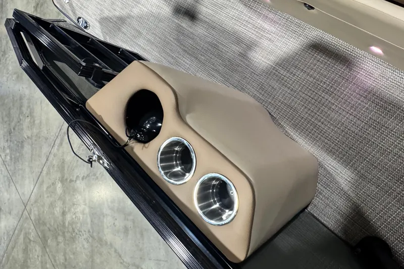 Slide: The Image of 2026 Veranda Relax VR265VLI boat interior with cup holders and beige upholstery. - 18