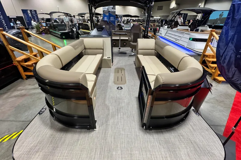 Slide: The Image of 2026 Veranda Relax VR265VLI pontoon boat with spacious seating at a boat show. - 4