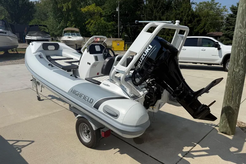 Slide: The Image of 2025 Highfield Sport 390 boat with Suzuki outboard motor on a trailer. - 10