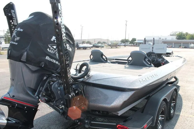 Slide: The Image of 2025 Skeeter ZXR21 boat with dual Garmin displays and powerful outboard motor. - 4