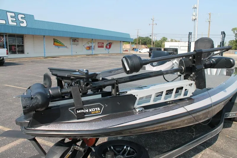 Slide: The Image of 2025 Skeeter ZXR21 boat with Minn Kota Ultrex trolling motor in parking lot. - 6