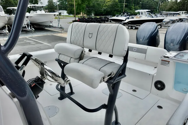 Slide: The Image of 2026 Sea Fox 268 Commander boat interior with dual seats and steering wheel. - 6