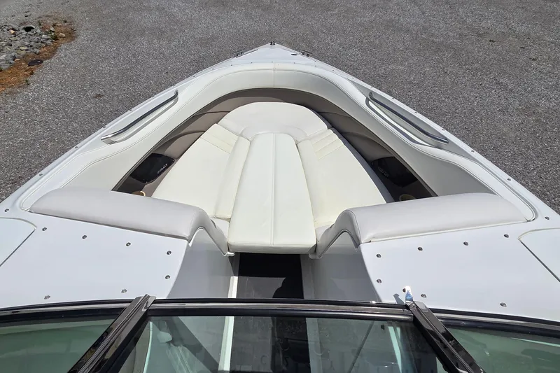 Slide: The Image of 2003 Cobalt 282 boat with white leather seating, viewed from above. - 11