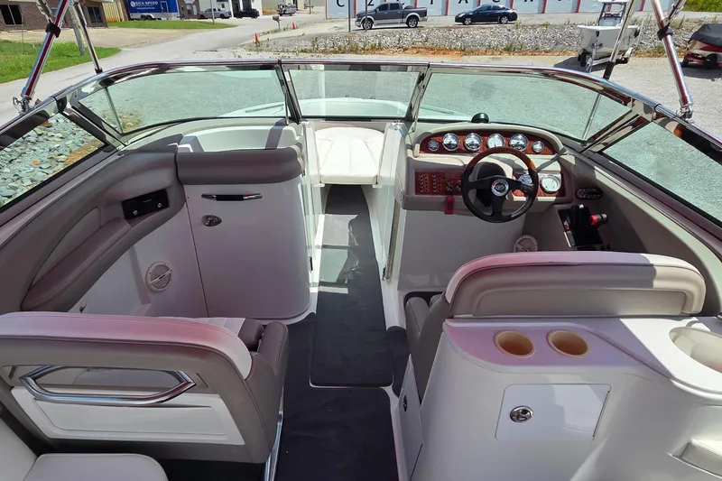 Slide: The Image of Interior of a 2003 Cobalt 282 boat, featuring a sleek dashboard and comfortable seating. - 5