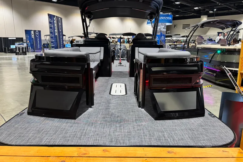 Slide: The Image of 2026 Veranda Vertex VX285DCRC Premium boat interior at a showroom, showcasing luxury seating. - 2