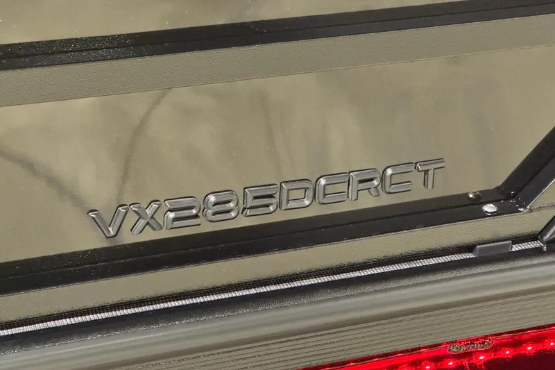 Slide: The Image of 2026 Veranda Vertex VX285DCRC Premium model badge on vehicle exterior. - 3