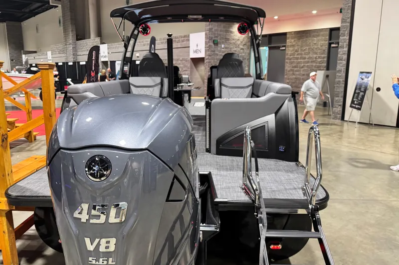 Slide: The Image of 2026 Veranda Vertex VX285DCRC Premium boat with powerful V8 engine on display indoors. - 6