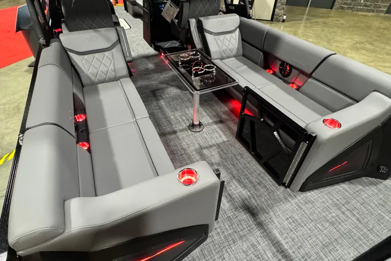Slide: The Image of Luxurious interior of 2026 Veranda Vertex VX285DCRC Premium pontoon boat with gray seating and red lighting. - 9