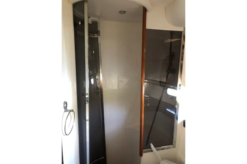 Slide: The Image of Bathroom interior of 2002 Birchwood Challenger 460 Flybridge yacht, featuring a shower area. - 107