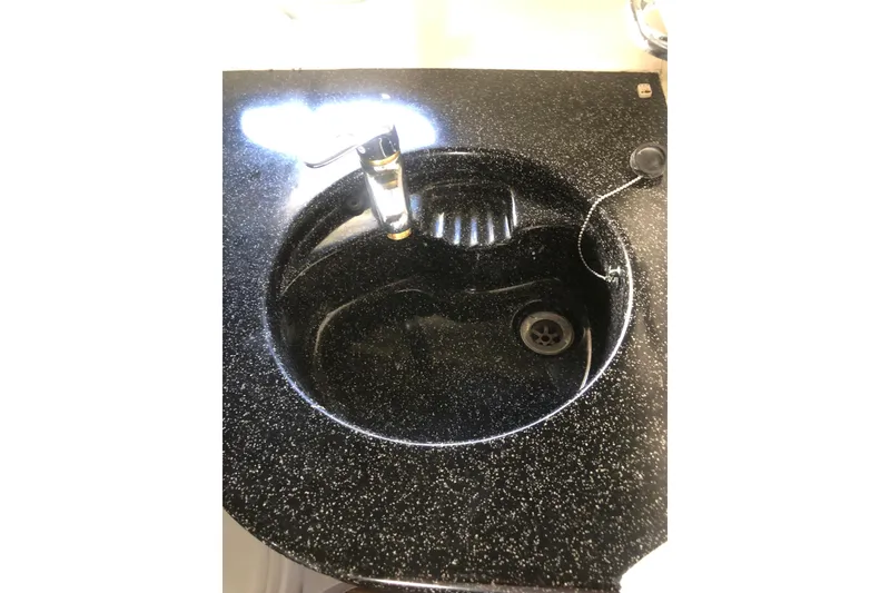 Slide: The Image of Black speckled sink in 2002 Birchwood Challenger 460 Flybridge yacht. - 110