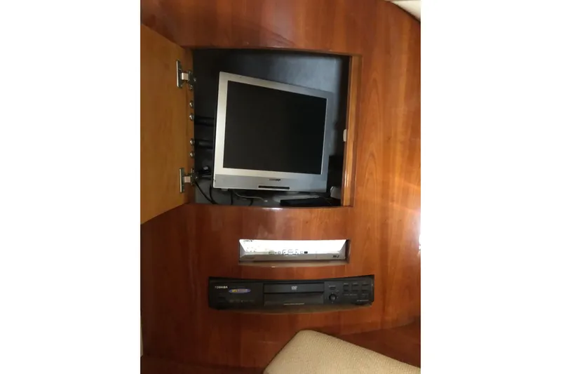 Slide: The Image of Built-in TV and audio system on Birchwood Challenger 460 Flybridge, 2002 model. - 111