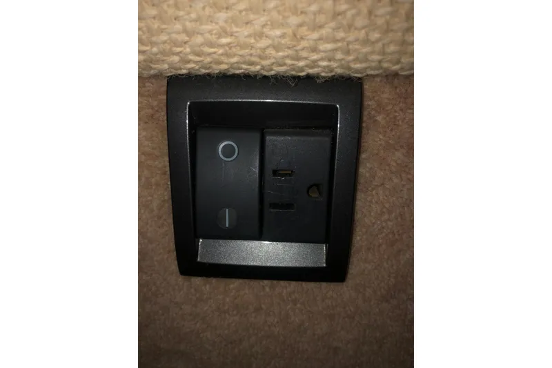 Slide: The Image of Power switch and outlet on 2002 Birchwood Challenger 460 Flybridge yacht interior. - 112