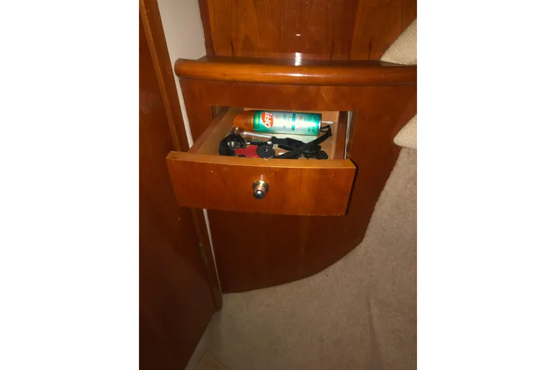 Slide: The Image of Open drawer in Birchwood Challenger 460 Flybridge, 2002, with items inside. - 113