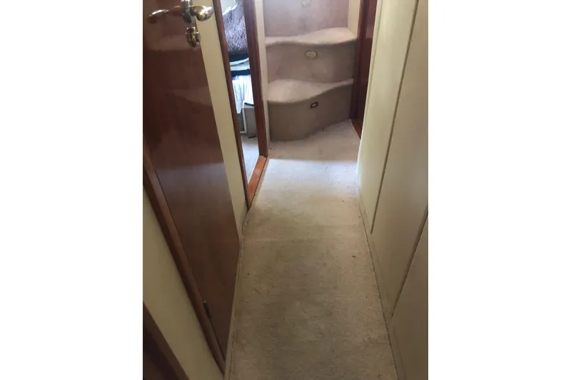 Slide: The Image of Interior hallway of 2002 Birchwood Challenger 460 Flybridge yacht with carpeted stairs. - 114