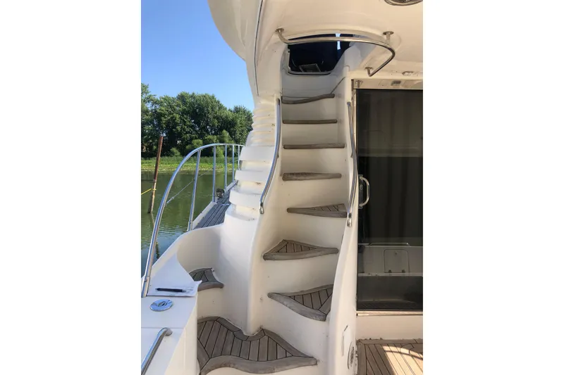 Slide: The Image of Staircase on 2002 Birchwood Challenger 460 Flybridge yacht, leading to upper deck. - 16