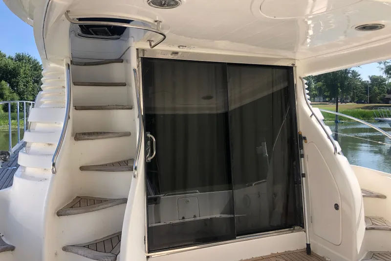 Slide: The Image of Staircase and sliding door on 2002 Birchwood Challenger 460 Flybridge yacht. - 17