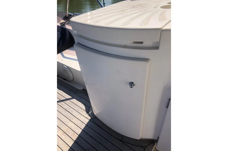 Slide: The Image of 2002 Birchwood Challenger 460 Flybridge boat deck with storage compartment. - 23