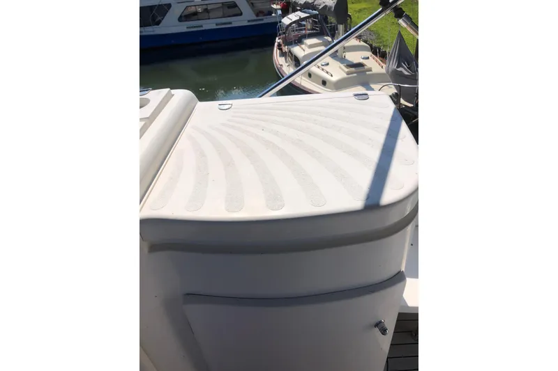 Slide: The Image of 2002 Birchwood Challenger 460 Flybridge deck detail with textured surface and railing. - 26