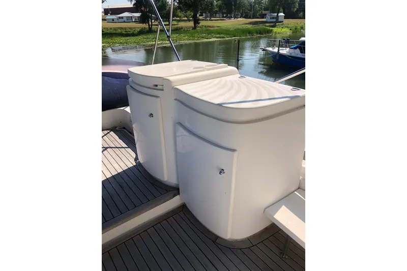 Slide: The Image of 2002 Birchwood Challenger 460 Flybridge deck with storage compartments. - 29