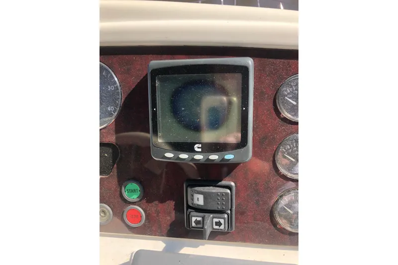 Slide: The Image of Control panel of 2002 Birchwood Challenger 460 Flybridge with gauges and buttons. - 35