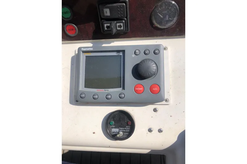 Slide: The Image of Control panel of 2002 Birchwood Challenger 460 Flybridge with Raymarine autopilot system. - 36
