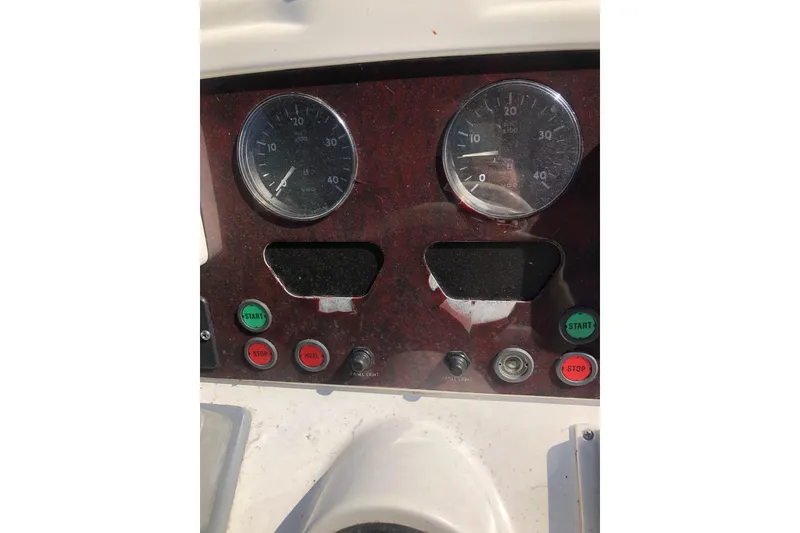 Slide: The Image of Dashboard of 2002 Birchwood Challenger 460 Flybridge with gauges and control buttons. - 37