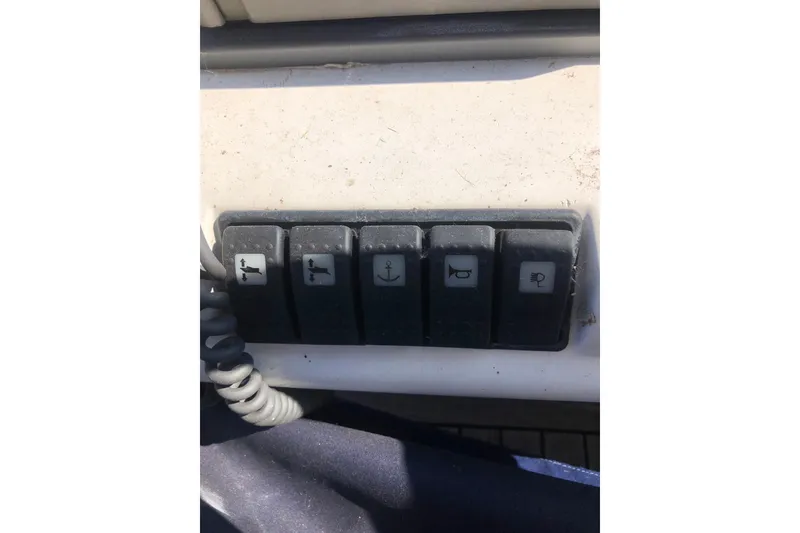 Slide: The Image of Control panel switches on a 2002 Birchwood Challenger 460 Flybridge yacht. - 43