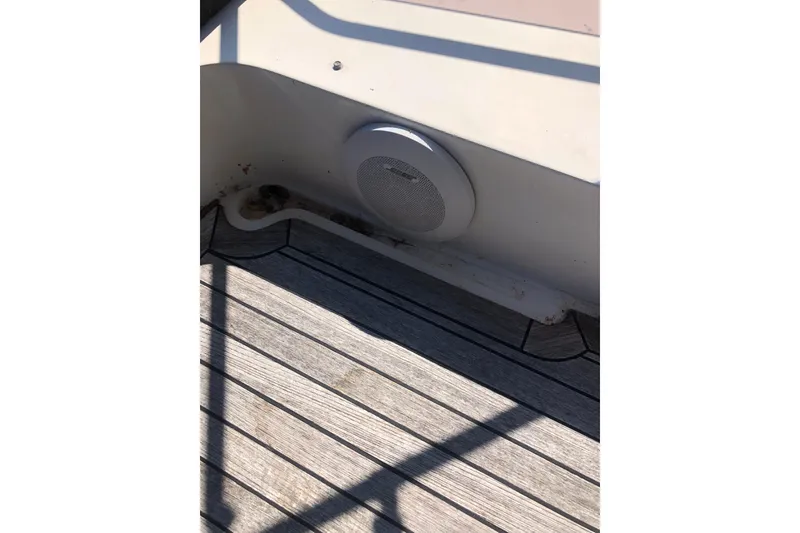 Slide: The Image of Birchwood Challenger 460 Flybridge 2002 boat deck with speaker and wooden flooring. - 44