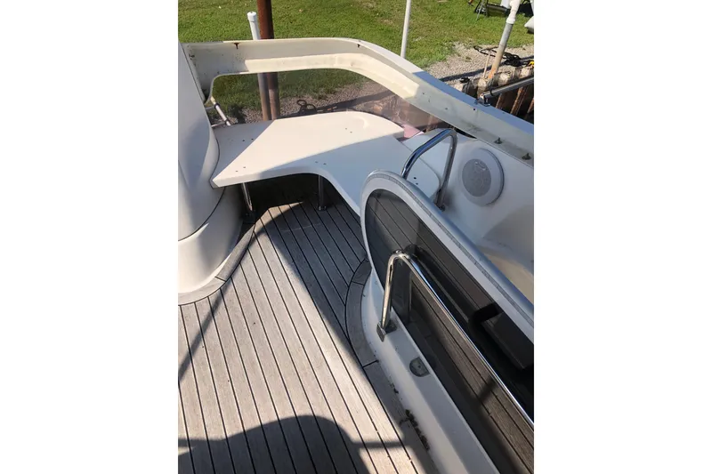 Slide: The Image of Flybridge deck of 2002 Birchwood Challenger 460, featuring sleek design and wooden flooring. - 46