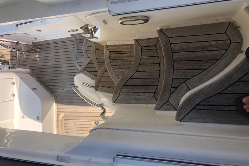 Slide: The Image of Teak deck of 2002 Birchwood Challenger 460 Flybridge yacht, showcasing elegant design. - 49