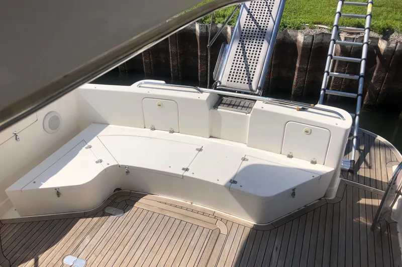 Slide: The Image of 2002 Birchwood Challenger 460 Flybridge yacht with spacious deck seating and ladder. - 51