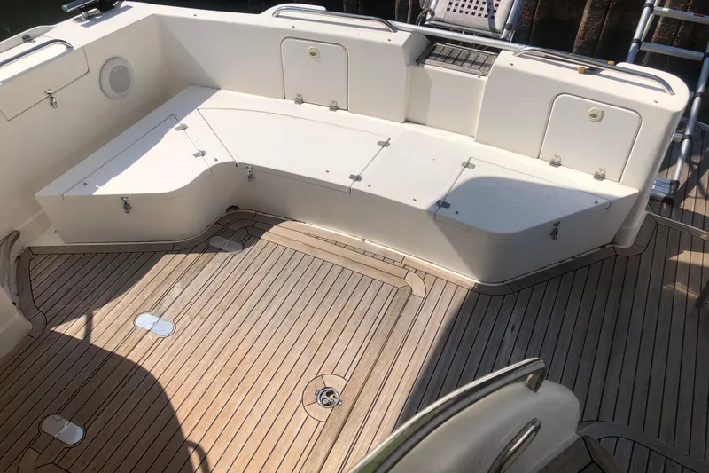 Slide: The Image of Birchwood Challenger 460 Flybridge 2002, featuring spacious deck seating and teak flooring. - 52