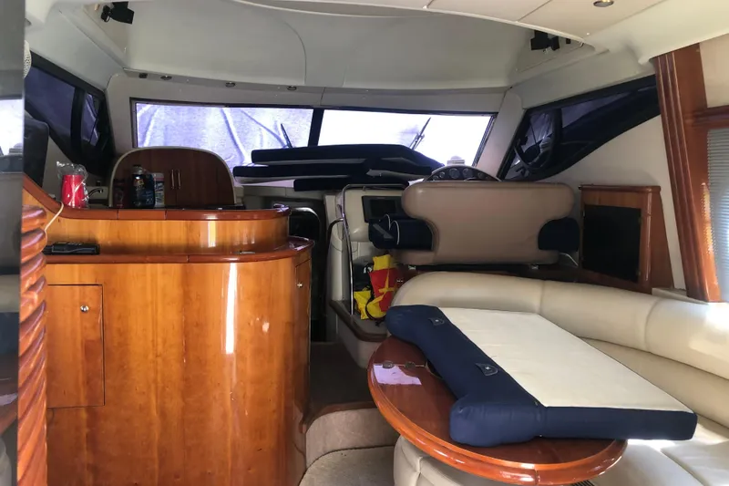 Slide: The Image of Interior of 2002 Birchwood Challenger 460 Flybridge yacht with elegant wood finish and seating area. - 53