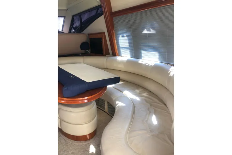 Slide: The Image of Luxurious interior of 2002 Birchwood Challenger 460 Flybridge with curved leather seating. - 55