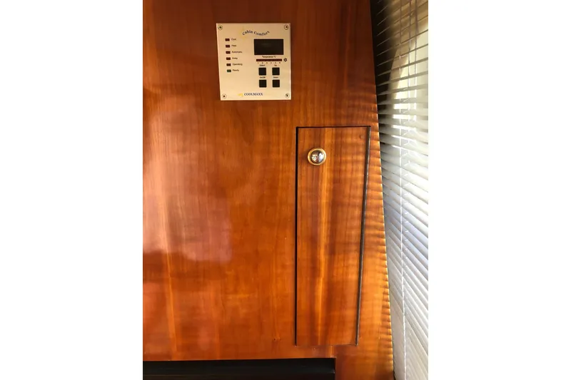 Slide: The Image of Wooden panel with control panel on Birchwood Challenger 460 Flybridge, 2002 model. - 60