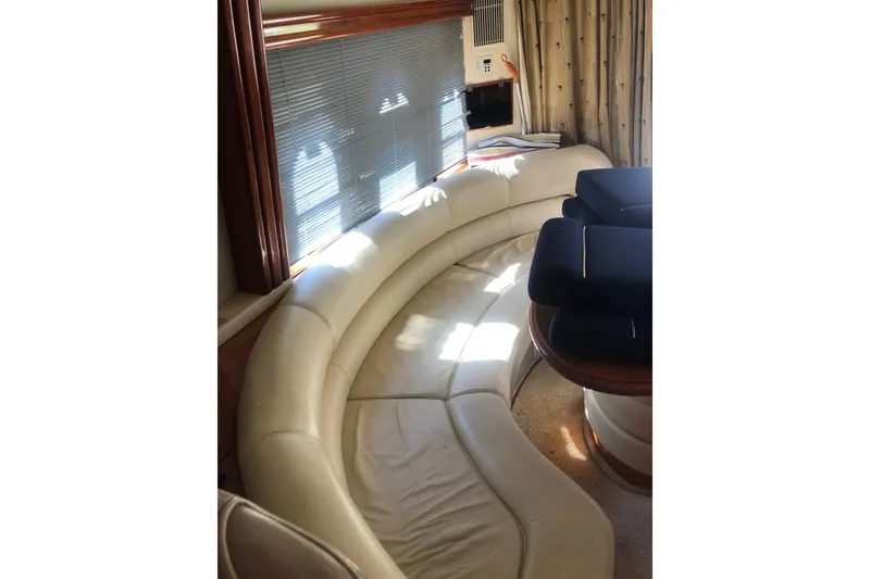 Slide: The Image of Luxurious interior of 2002 Birchwood Challenger 460 Flybridge with curved leather seating. - 71
